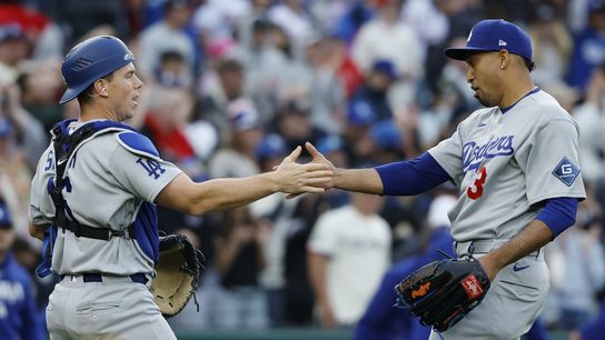 Los Angeles Dodgers pitcher Edwin Daz (3) celebrates with Dodgers catcher Will Smith (16) after the final out against the Washington Nationals at Nationals Park. Los Angeles Dodgers pitcher Edwin Daz (3) celebrates with Dodgers catcher Will Smith (16) after the final out against the Washington Nationals at Nationals Park.