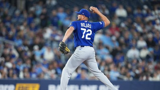Los Angeles Dodgers infielder Miguel Rojas (72) throws a pitch against the Toronto Blue Jays at during the ninth inning at Rogers Centre. Los Angeles Dodgers infielder Miguel Rojas (72) throws a pitch against the Toronto Blue Jays at during the ninth inning at Rogers Centre.