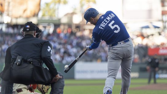Los Angeles Dodgers first baseman Freddie Freeman (5) hits a single during the first inning against the San Francisco Giants at Oracle Park. 