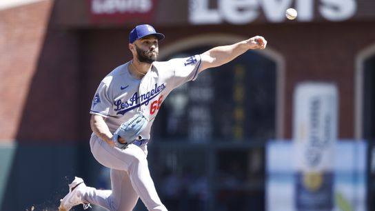 Los Angeles Dodgers relief pitcher Tanner Scott (66) pitches the ball against the San Francisco Giants during the ninth inning at Oracle Park. 