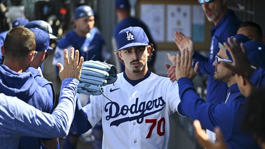 Los Angeles Dodgers pitcher Justin Wrobleski (70) celebrates in the dugout after the sixth inning against the Chicago Cubs at Dodger Stadium. 