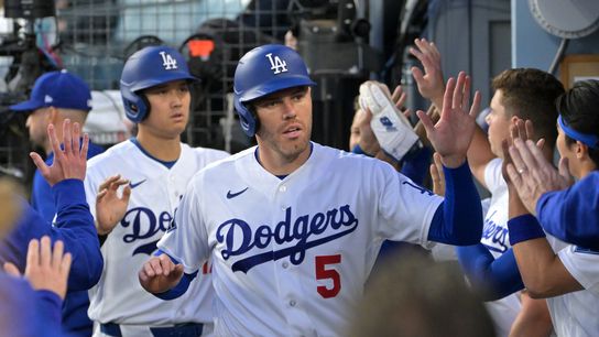 Los Angeles Dodgers first baseman Freddie Freeman (5) and two-way player Shohei Ohtani (17) celebrate in the dugout after scoring against the Miami Marlins in the first inning at Dodger Stadium. Los Angeles Dodgers first baseman Freddie Freeman (5) and two-way player Shohei Ohtani (17) celebrate in the dugout after scoring against the Miami Marlins in the first inning at Dodger Stadium.
