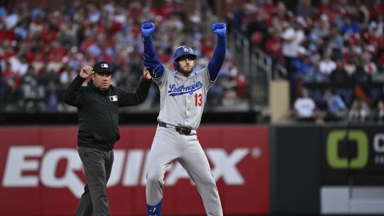 Los Angeles Dodgers third baseman Max Muncy (13) celebrates after hitting an RBI double against the St. Louis Cardinals in the second inning at Busch Stadium. 