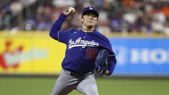 Los Angeles Dodgers starting pitcher Yoshinobu Yamamoto (18) delivers a pitch during the second inning against the Houston Astros at Daikin Park. 