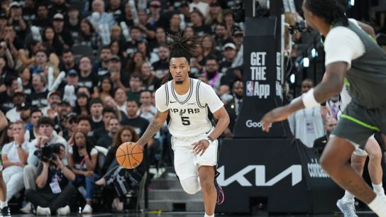 May 6, 2026; San Antonio, Texas, USA; San Antonio Spurs guard Stephon Castle (5) looks up the court in the second half against the Minnesota Timberwolves during game two of the second round of the 2026 NBA Playoffs at Frost Bank Center. 
