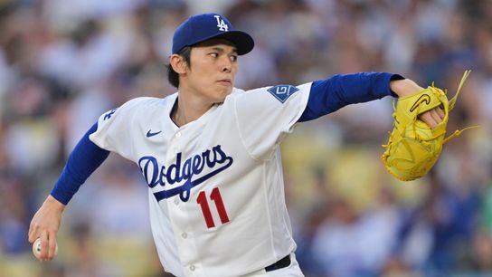 Los Angeles Dodgers starting pitcher Roki Sasaki (11) delivers a pitch in the first inning against the San Francisco Giants at Dodger Stadium. 