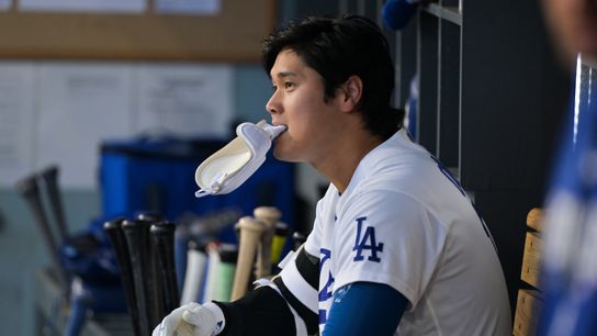 Los Angeles Dodgers two-way player Shohei Ohtani (17) looks on from the dugout in the first inning against against the San Francisco Giants at Dodger Stadium. 