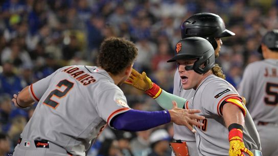 San Francisco Giants center fielder Harrison Bader (9) celebrates with shortstop Willy Adames (2) after hitting a one run home run against Los Angeles Dodgers starting pitcher Yoshinobu Yamamoto