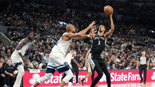 May 12, 2026; San Antonio, Texas, USA; San Antonio Spurs forward Victor Wembanyama (1) fakes to shoot over Minnesota Timberwolves center Rudy Gobert (27) during the second half of game five of the second round of the 2026 NBA Playoffs at Frost Bank Center.