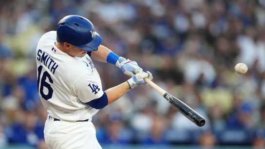 Los Angeles Dodgers catcher Will Smith (16) hits a solo home run against the San Francisco Giants in the first inning at Dodger Stadium. 