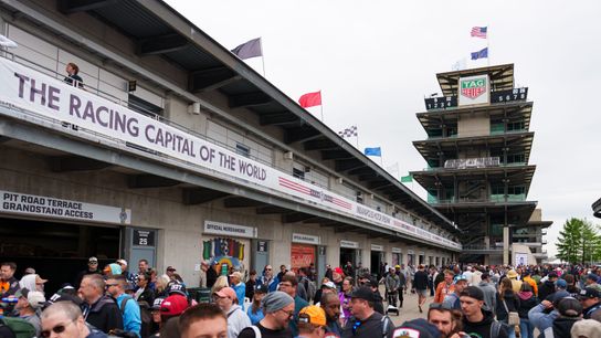 Fans walk to and from Gasoline Alley Friday, May 22, 2026, on Carb Day ahead of the 110th running of the Indianapolis 500 at Indianapolis Motor Speedway.