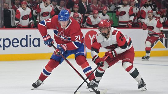 May 25, 2026; Montreal, Quebec, CAN; Montreal Canadiens defenseman Kaiden Guhle (21) skates against Carolina Hurricanes center Seth Jarvis (24) during overtime in game three of the Eastern Conference Final of the 2026 Stanley Cup Playoffs at Bell Centre. 