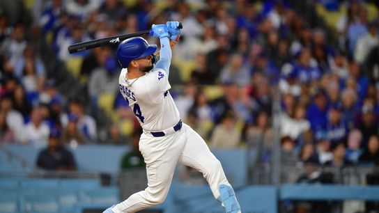 Los Angeles Dodgers center fielder Andy Pages (44) hits a solo home run during the third inning against the Colorado Rockies at Dodger Stadium. 