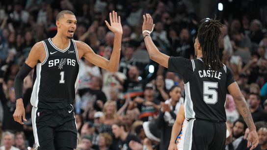 May 28, 2026; San Antonio, Texas, USA; San Antonio Spurs forward Victor Wembanyama (1) reacts with guard Stephon Castle (5) in the second half during game six of the western conference finals for the 2026 NBA playoffs at Frost Bank Center.