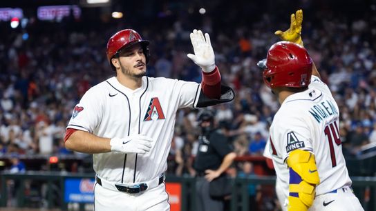Arizona Diamondbacks third baseman Nolan Arenado celebrates with teammates after hitting a solo home run against the Los Angeles Dodgers in the seventh inning at Chase Field. Arizona Diamondbacks third baseman Nolan Arenado celebrates with teammates after hitting a solo home run against the Los Angeles Dodgers in the seventh inning at Chase Field.