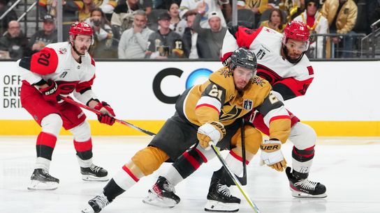 Jun 6, 2026; Las Vegas, Nevada, USA; Vegas Golden Knights center Brett Howden (21) reaches for the puck defended by Carolina Hurricanes defenseman K'andre Miller (19) during the second overtime in game three of the 2026 Stanley Cup Final at T-Mobile Arena. Jun 6, 2026; Las Vegas, Nevada, USA; Vegas Golden Knights center Brett Howden (21) reaches for the puck defended by Carolina Hurricanes defenseman K'andre Miller (19) during the second overtime in game three of the 2026 Stanley Cup Final at T-Mobile Arena.
