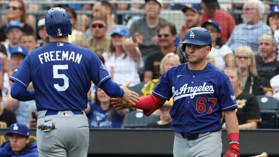 Los Angeles Dodgers left fielder Ryan Ward (67) congratulate first baseman Freddie Freeman (5) after Freeman scored a run against the Pittsburgh Pirates during the third inning at PNC Park. Los Angeles Dodgers left fielder Ryan Ward (67) congratulate first baseman Freddie Freeman (5) after Freeman scored a run against the Pittsburgh Pirates during the third inning at PNC Park.