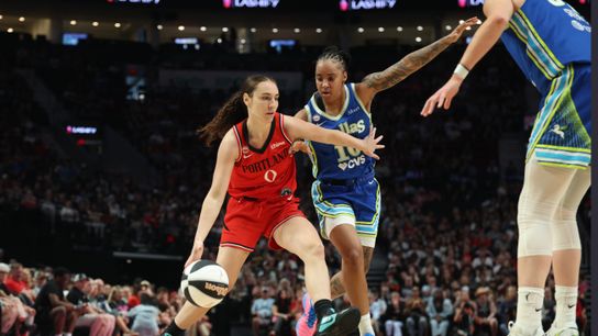 Jun 13, 2026; Portland, Oregon, USA; Portland Fire guard Carla Leite (0) drives to the basket against Dallas Wings guard Aziaha James (10) during the first half at Moda Center