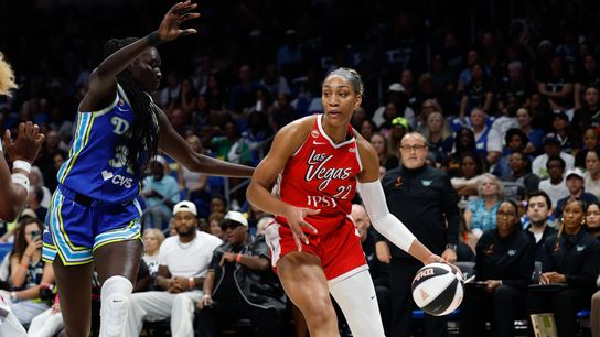 Jun 15, 2026; Arlington, Texas, USA; Las Vegas Aces center A'ja Wilson (22) controls the ball as Dallas Wings forward Awak Kuier (34) defends during the first half at College Park Center. Jun 15, 2026; Arlington, Texas, USA; Las Vegas Aces center A'ja Wilson (22) controls the ball as Dallas Wings forward Awak Kuier (34) defends during the first half at College Park Center.