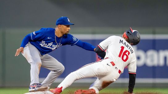Los Angeles Dodgers shortstop Mookie Betts (50) tags out Minnesota Twins center fielder Austin Martin (16) in the eighth inning at Target Field. Los Angeles Dodgers shortstop Mookie Betts (50) tags out Minnesota Twins center fielder Austin Martin (16) in the eighth inning at Target Field.