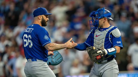 Los Angeles Dodgers relief pitcher Tanner Scott (66) celebrates with catcher Dalton Rushing (68) after defeating the Minnesota Twins at Target Field. 