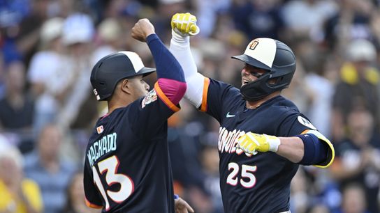 San Diego Padres first baseman Ty France (25) is congratulated by third baseman Manny Machado (13) (30) after hitting a three-run home run during the second inning against the Los Angeles Dodgers at P... 
