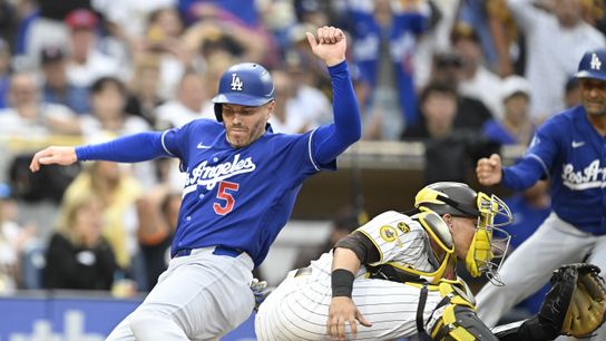 Los Angeles Dodgers first baseman Freddie Freeman (5) scores ahead of the throw to San Diego Padres catcher Freddy Fermin (54) during the sixth inning at Petco Park. 