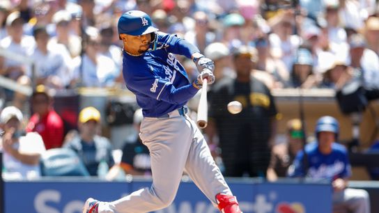 Los Angeles Dodgers shortstop Mookie Betts (50) hits a two-run single during the fifth inning against the San Diego Padres at Petco Park. 