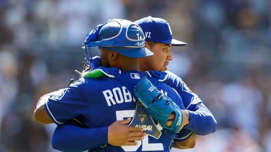 Los Angeles Dodgers relief pitcher Edgardo Henriquez (60) celebrates with catcher Chuckie Robinson (52) after defeating the San Diego Padres at Petco Park. 