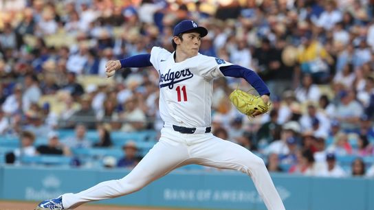 Los Angeles Dodgers pitcher Roki Sasaki (11) pitches against the San Diego Padres in the first inning at Dodger Stadium. 