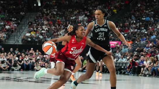 Jul 5, 2026; Las Vegas, Nevada, USA; Indiana Fever guard Kelsey Mitchell (0) drives against Las Vegas Aces forward Brianna Turner (21) in the fourth quarter of their game at T-Mobile Arena. Jul 5, 2026; Las Vegas, Nevada, USA; Indiana Fever guard Kelsey Mitchell (0) drives against Las Vegas Aces forward Brianna Turner (21) in the fourth quarter of their game at T-Mobile Arena.