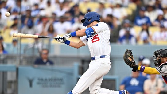 Los Angeles Dodgers left fielder Tommy Edman (25) hits an RBI double against the Arizona Diamondbacks during the third inning at Dodger Stadium. 