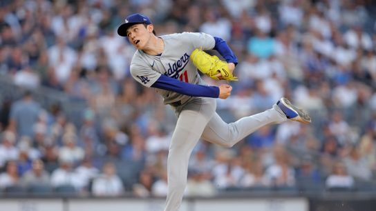 Los Angeles Dodgers starting pitcher Roki Sasaki (11) follows through on a pitch against the New York Yankees during the second inning at Yankee Stadium. Los Angeles Dodgers starting pitcher Roki Sasaki (11) follows through on a pitch against the New York Yankees during the second inning at Yankee Stadium.