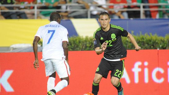 October 10, 2015; Pasadena, CA, USA; Mexico defender Paul Aguilar (22) moves the ball against USA defender DeMarcus Beasley (7) during the second half of the CONCACAF Cup at Rose Bowl. 