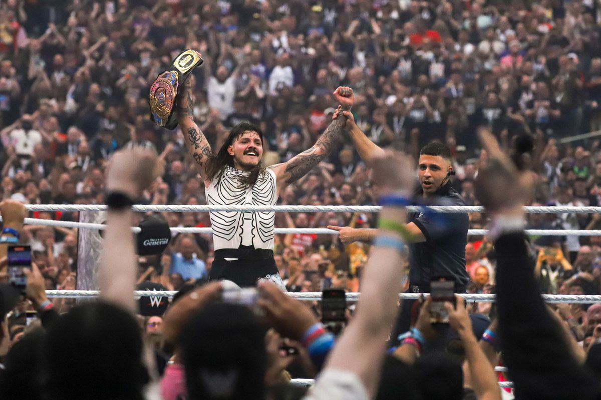 Dominik Mysterio holds up the championship belt after defeating Baron Breaker, Finn Balor and Penta in the Intercontinental Championship during WrestleMania 41 In Las Vegas on Sunday April 20, 2025.