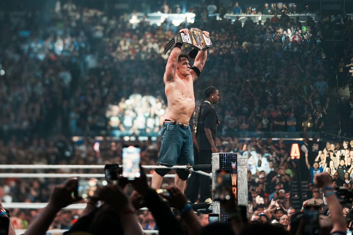 John Cena holds up the championship belt after defeating Cody Rhodes in WWE Championship match during WrestleMania 41 In Las Vegas on Sunday April 20, 2025.