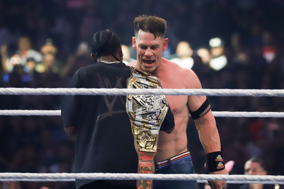 John Cena celebrates with Travis Scott defeating Cody Rhodes in WWE Championship match during WrestleMania 41 In Las Vegas on Sunday April 20, 2025.