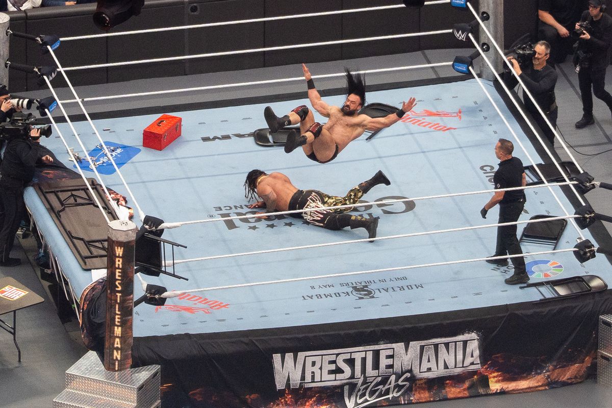 WWE wrestler Drew McIntyre launches towards Jacob Fatu in unsanctioned match during WrestleMania 42 on Saturday, April 18, 2026 at Allegiant Stadium.