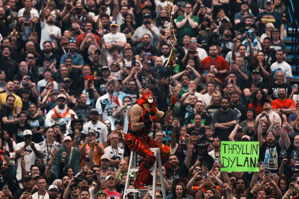 WWE wrestler Penta claims victory by grabbing the championship belt  in the Intercontinental Championship ladder match during WrestleMania 42 on Sunday April 19, 2026 at Allegiant Stadium.