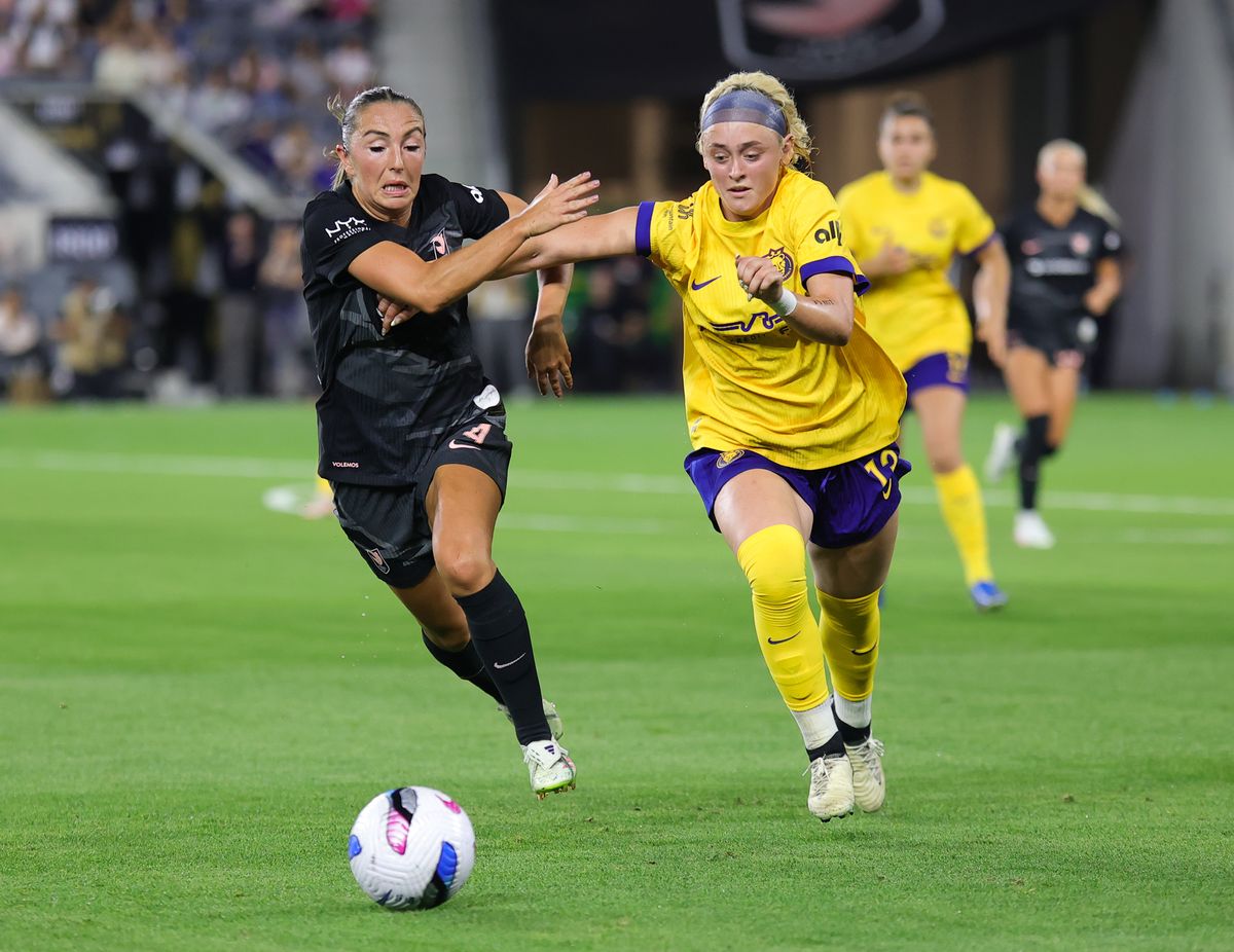 Angel City FC midfielder (4) Katie Zelem fights for possession of the ball against the Utah Royals on May 9, 2025 in Los Angeles, CA.