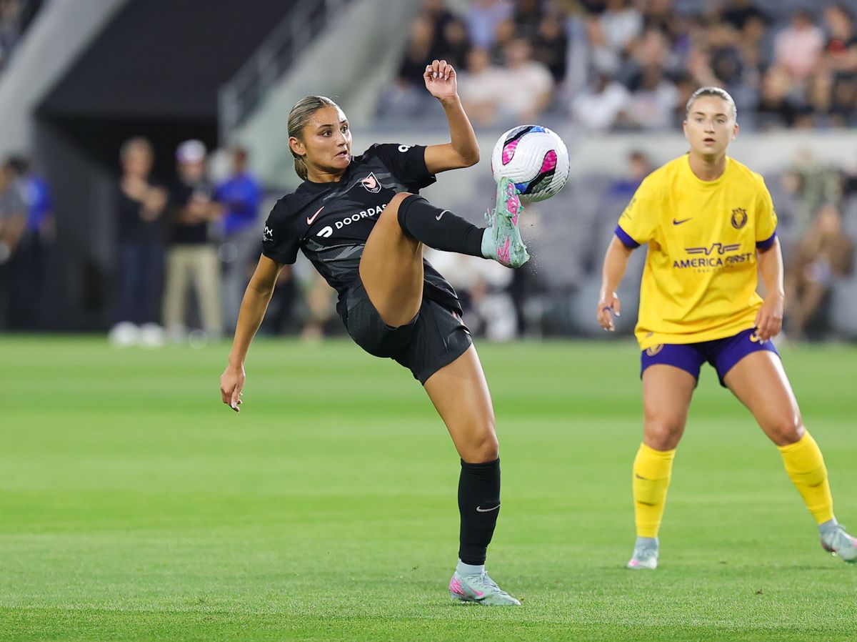 Angel City FC defender (20) Gisele Thompson kicks the ball downfield against the Utah Royals on May 9, 2024 in Los Angeles, CA.