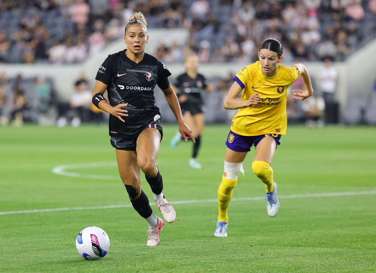 Angel City FC defender (11) Sarah Gorden kicks the ball downfield against the Utah Royals on May 9, 2025 in Los Angeles, CA.
