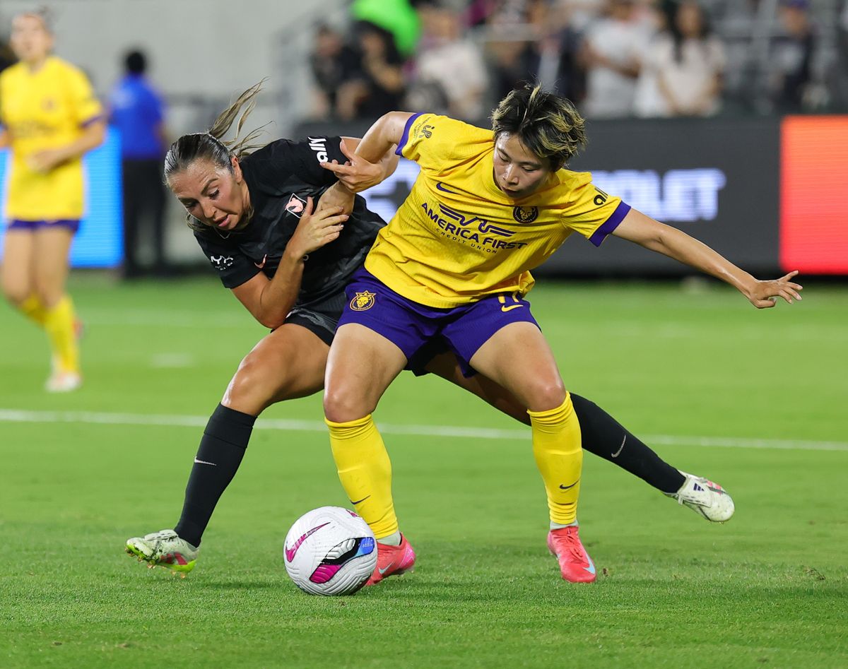 Angel City FC midfielder (4) Katie Zelem fights for possession of the ball against the Utah Royals on May 9, 2025 in Los Angeles, CA.
