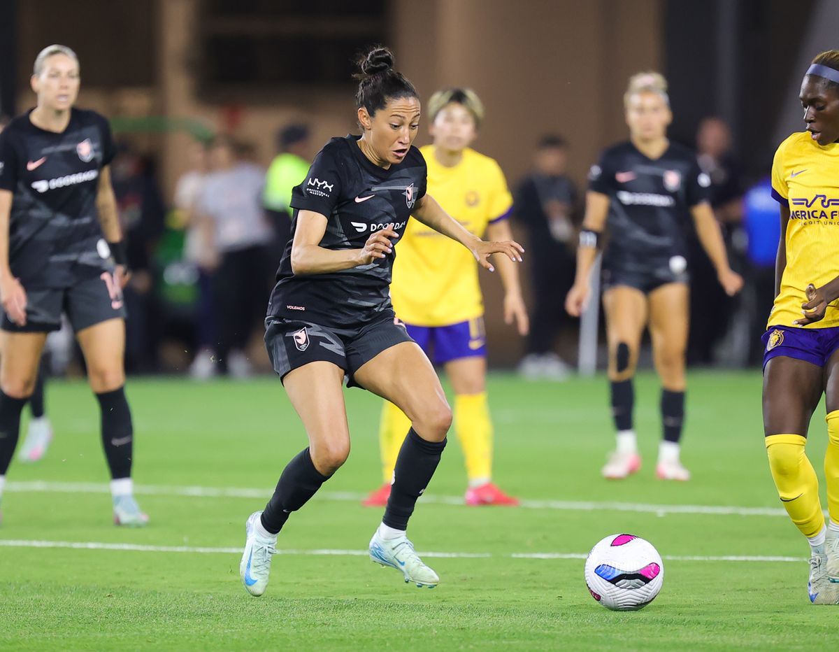 Angel City FC attacker (23) Christin Press kicks the ball downfield against the Utah Royals on May 9, 2025 in Los Angeles, CA.