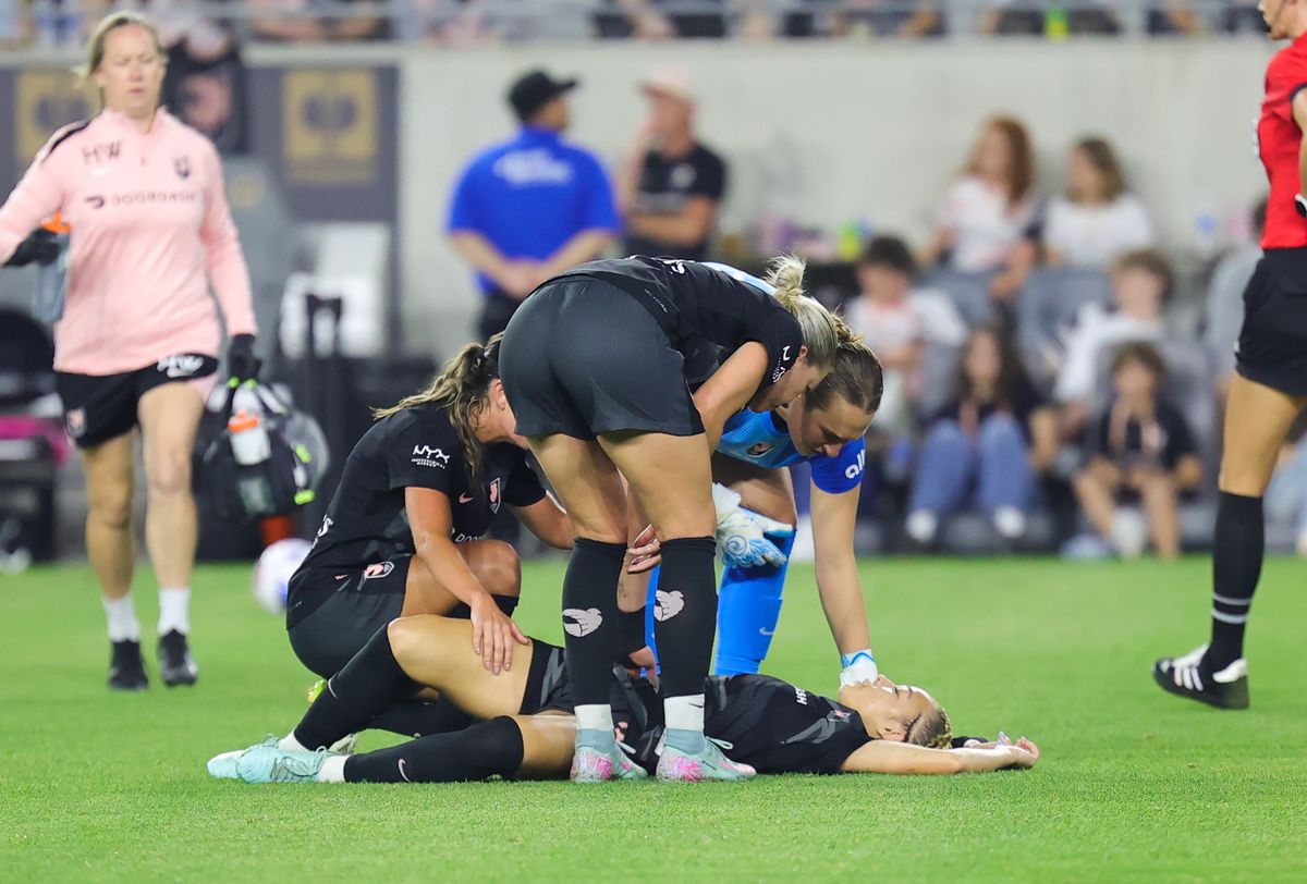 Angel City FC players check on injured teammate (3) Savy King during a NWSL match against the Utah Royals on May 9, 2024 in Los Angeles, CA.