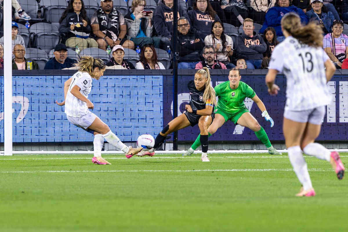 Racing Louisville FC midfielder Savannah DeMelo (7) scores a goal during an NWSL match against Angel City FC, Saturday May 24, 2025 in Los Angeles, Calif.