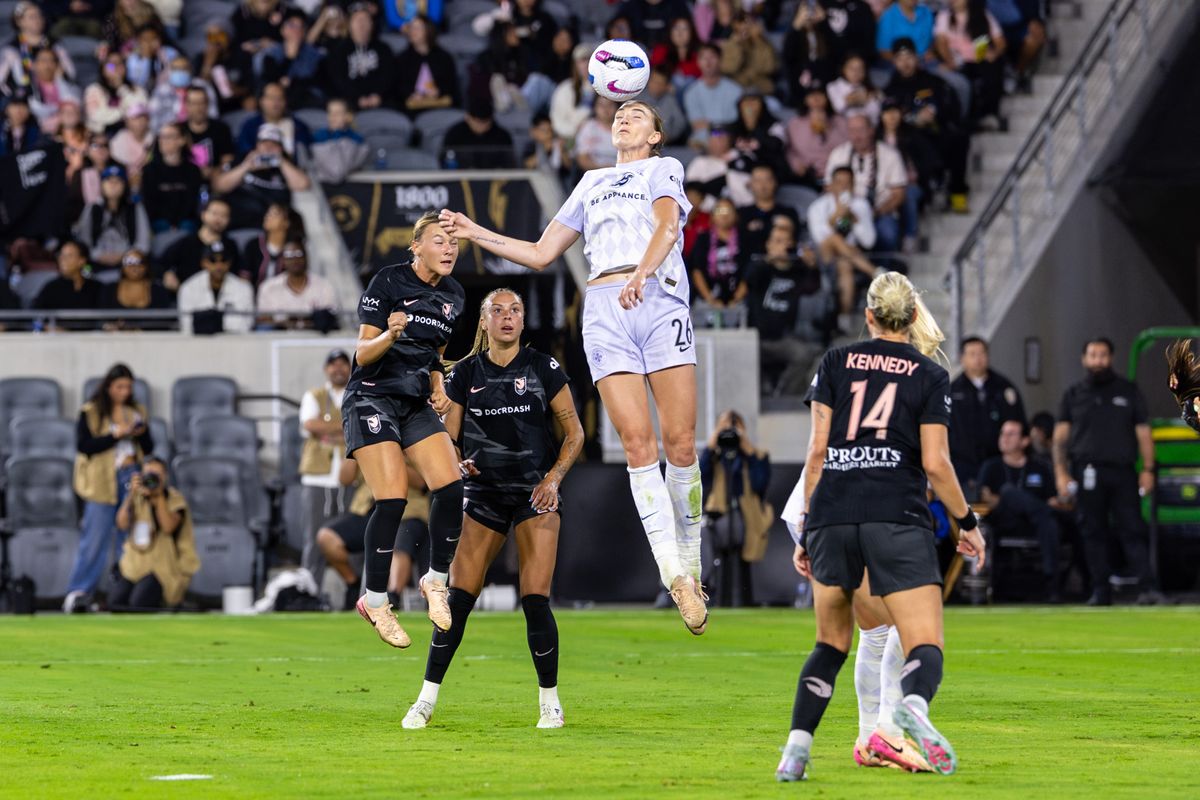 Racing Louisville FC midfielder Taylor Flint (26) heads the ball during an NWSL match against Angel City FC, Saturday May 24, 2025 in Los Angeles, Calif.