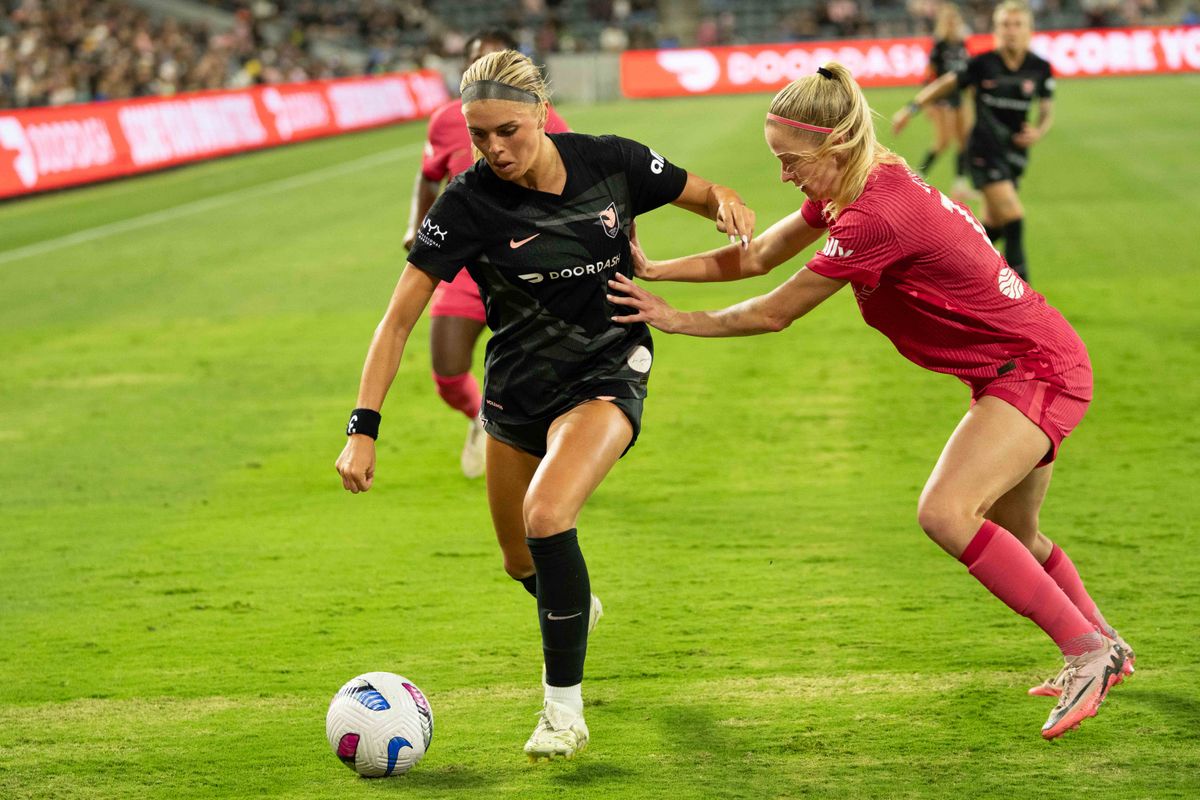 Angel City FC forward Riley Tiernan (33) fights for possession at an NWSL game against the NC Courage  on Saturday June 14th, 2025 in Los Angeles, California. 
