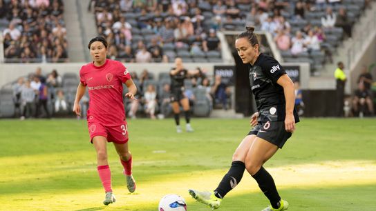 Angel City FC defender Megan Reid (6) passes the ball at an NWSL game against the NC Courage  on Saturday June 14th, 2025 in Los Angeles, California. 