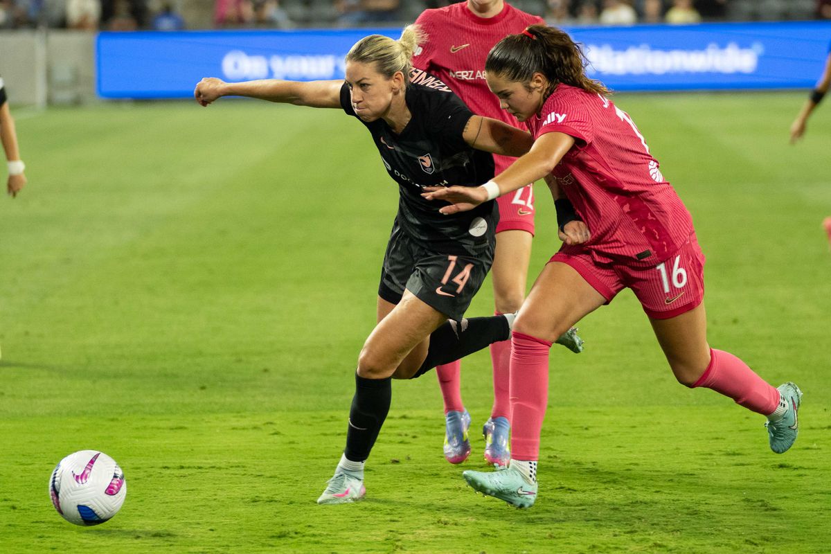 Angel City FC midfielder Alana Kennedy (14) fights for the ball in an NWSL game against the NC Courage  on Saturday June 14th, 2025 in Los Angeles, California. 